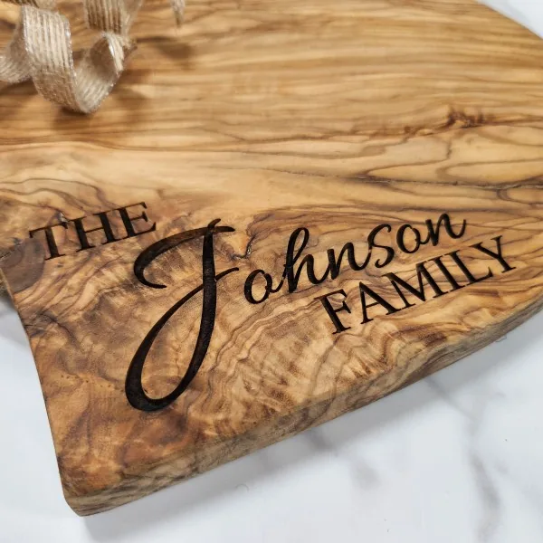 Close-up of detailed olivewood laser engraving