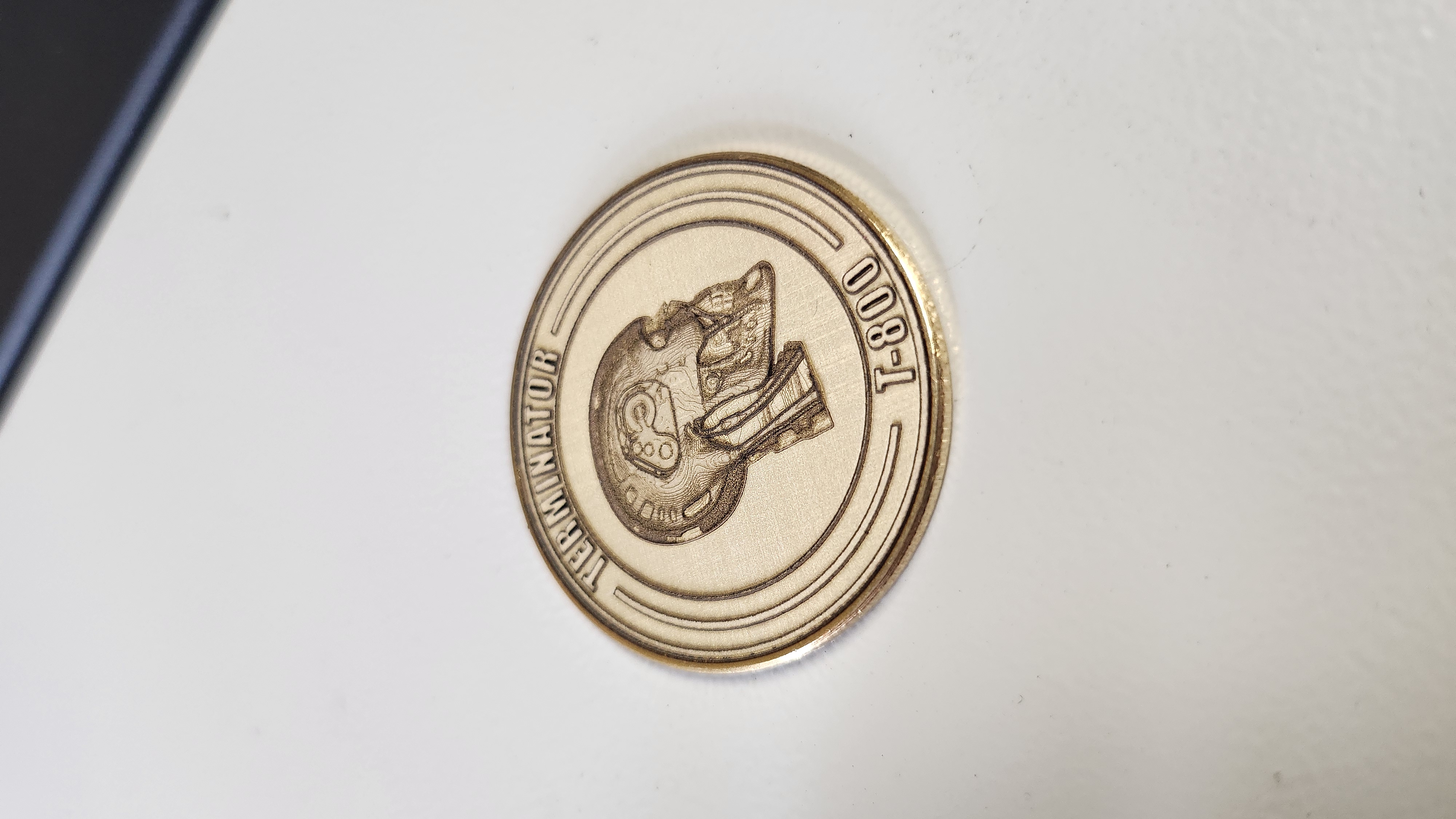 Engraved brass coin