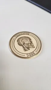 Engraved brass coin